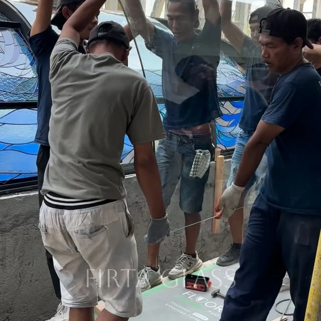 All the stained glass panels are now in place, and it’s time to install the protective glass.